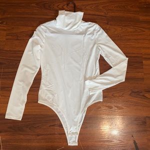 white longsleeve turtle neck bodysuit